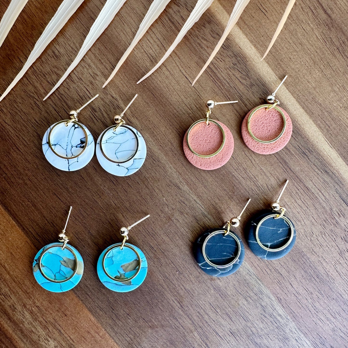 Round dangles with metal embellishment
