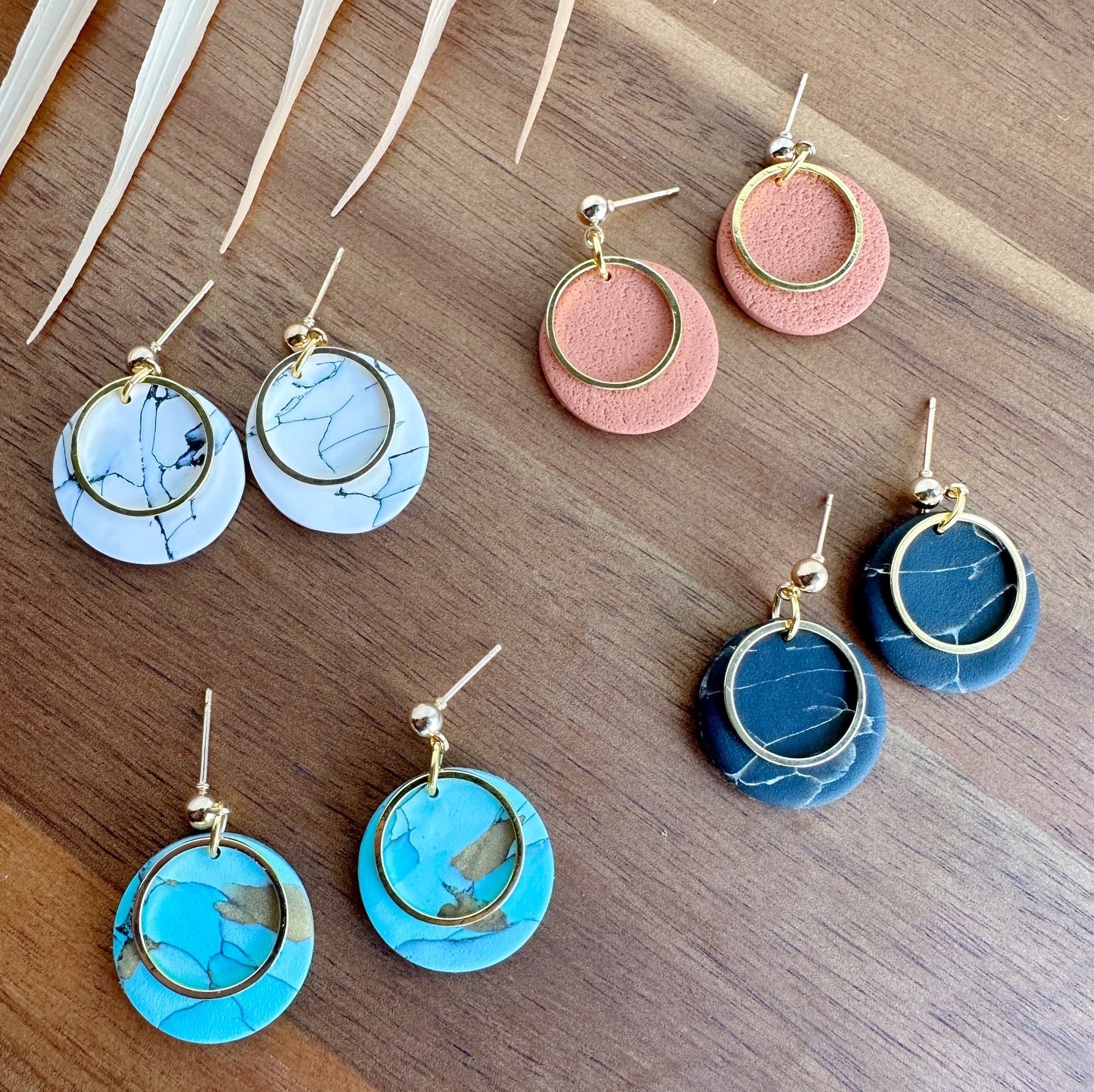 Round dangles with metal embellishment